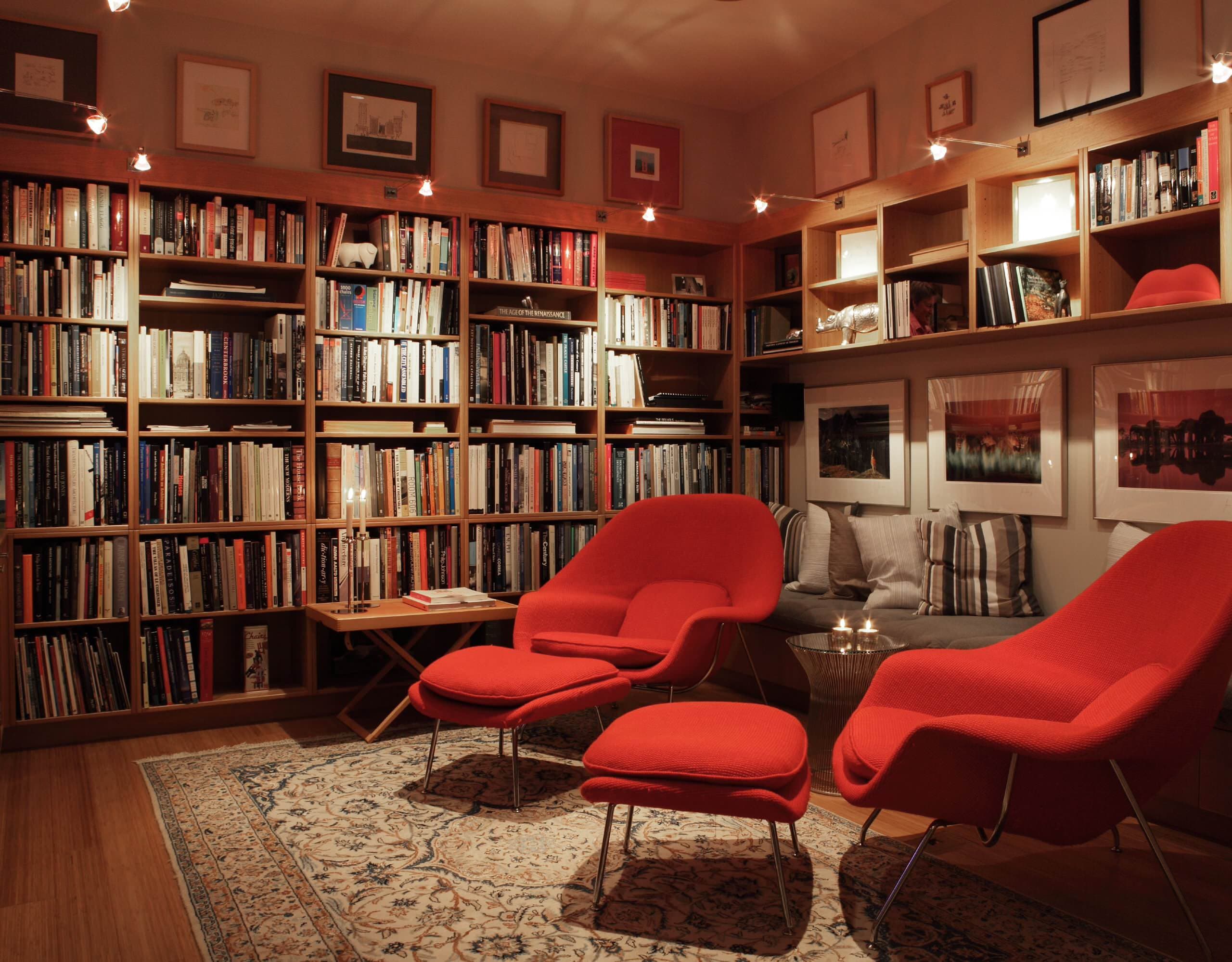 A warm library filled with bookshelves