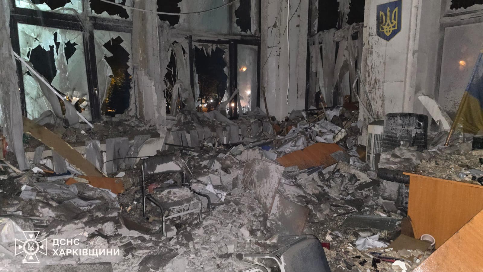 Emergency crews at Derzhprom in Kharkiv after the guided-bomb strike, floodlit at night